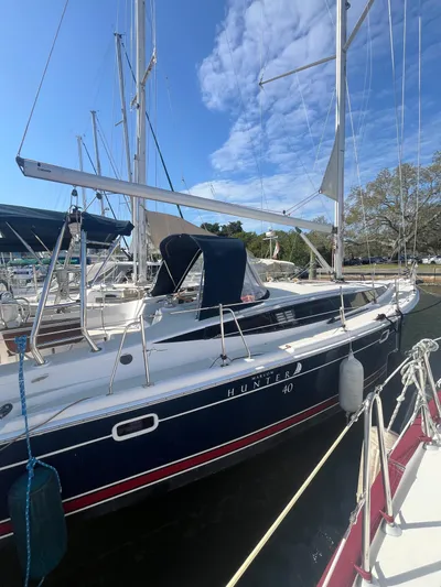 Pegasus Yacht Photos Pics 2015 Marlow-Hunter 40 sailboat docked at marina under clear blue sky.