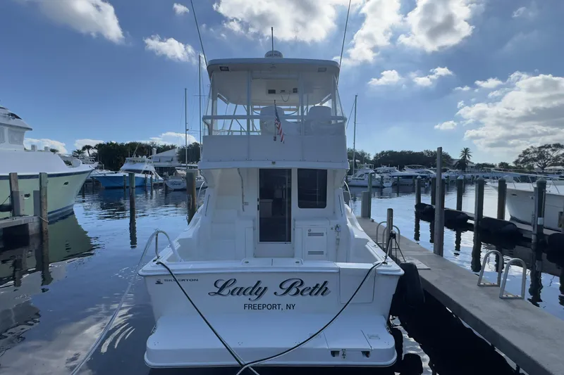  Yacht Photos Pics 2004 Silverton 38 Convertible yacht docked at marina, named "Lady Beth," Freeport, NY.