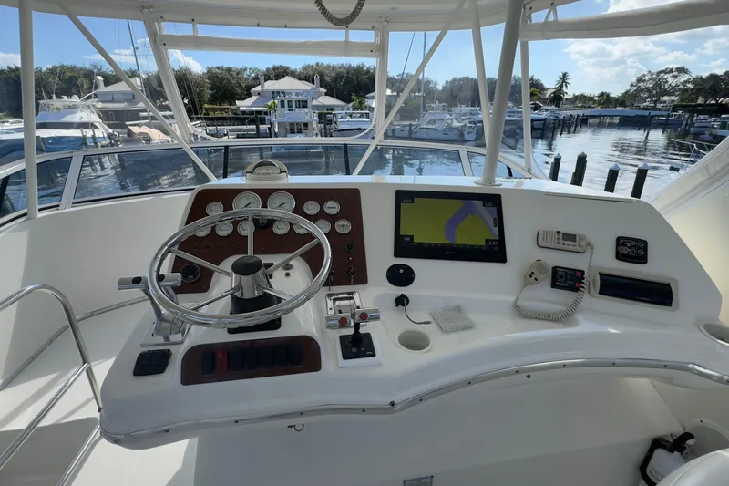  Yacht Photos Pics 2004 Silverton 38 Convertible yacht helm with navigation equipment and steering wheel.