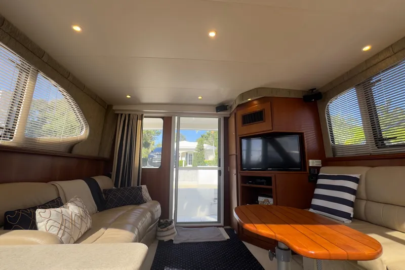  Yacht Photos Pics Luxurious interior of a 2004 Silverton 38 Convertible yacht with plush seating and modern amenities.