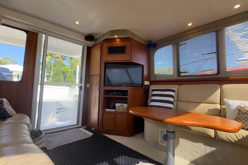  Yacht Photos Pics Interior of 2004 Silverton 38 Convertible yacht with cozy seating and entertainment area.