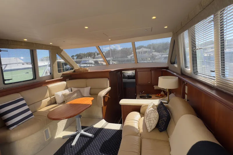  Yacht Photos Pics Luxurious interior of a 2004 Silverton 38 Convertible yacht with plush seating and elegant decor.