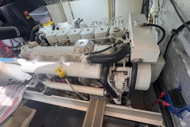  Yacht Photos Pics Engine room of a 2004 Silverton 38 Convertible yacht, showcasing a clean, well-maintained engine.