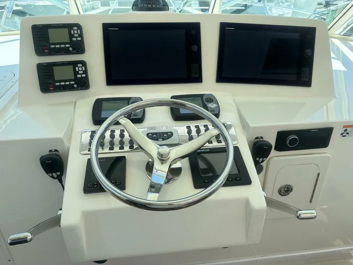 Squid Inc Yacht Photos Pics 2007 Albemarle 360 Express helm with dual screens, controls, and steering wheel.