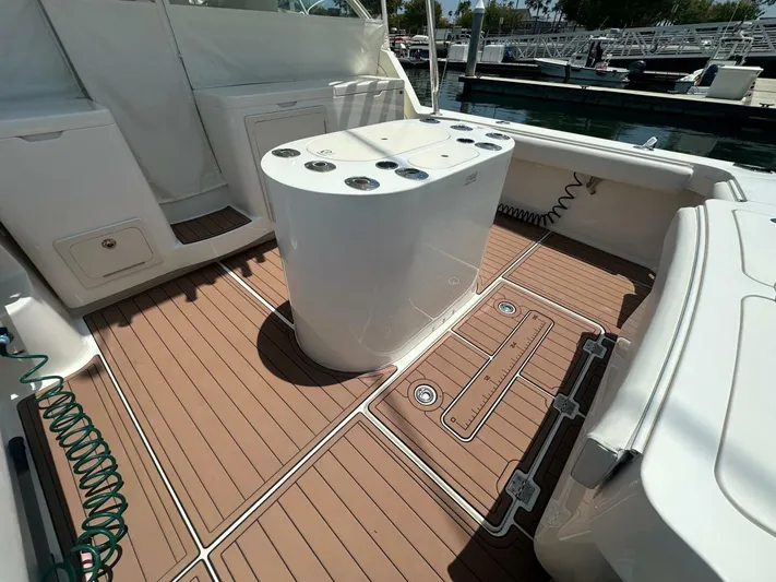 Squid Inc Yacht Photos Pics 2007 Albemarle 360 Express boat deck with teak flooring and fishing station.