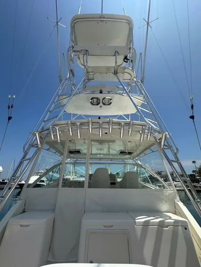 Squid Inc Yacht Photos Pics 2007 Albemarle 360 Express boat with tower, docked under clear blue sky.