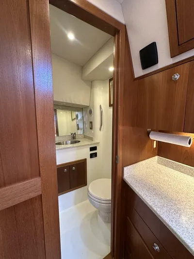 Squid Inc Yacht Photos Pics 2007 Albemarle 360 Express yacht bathroom with wood cabinetry and modern fixtures.