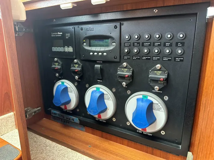 Squid Inc Yacht Photos Pics Electrical control panel on a 2007 Albemarle 360 Express boat, featuring Cummins Onan Marine Generator.