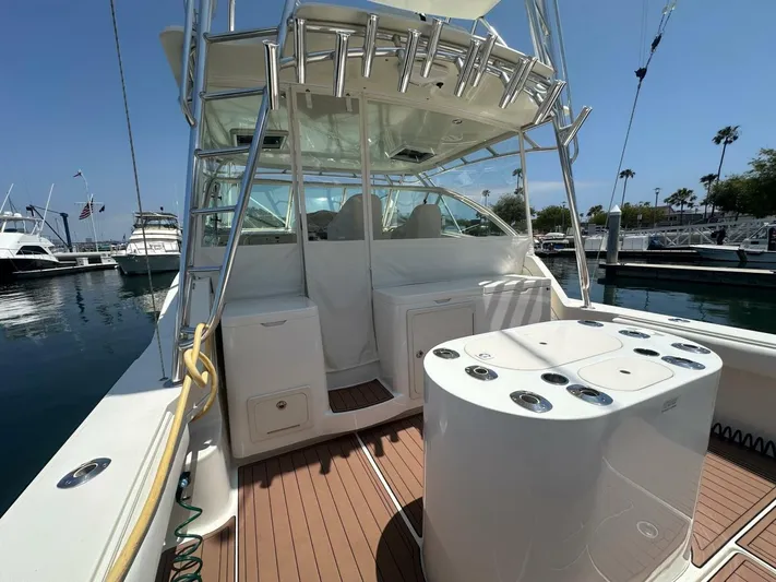 Squid Inc Yacht Photos Pics 2007 Albemarle 360 Express boat interior with fishing rod holders, docked at marina.