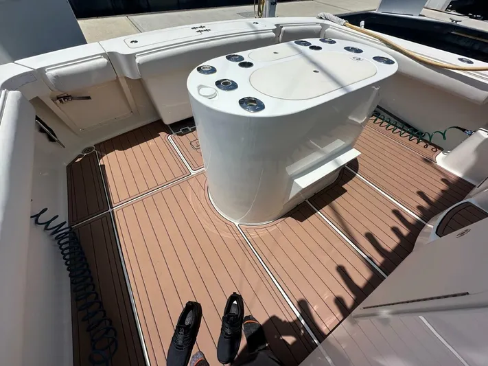 Squid Inc Yacht Photos Pics 2007 Albemarle 360 Express boat deck with fishing station and teak flooring.