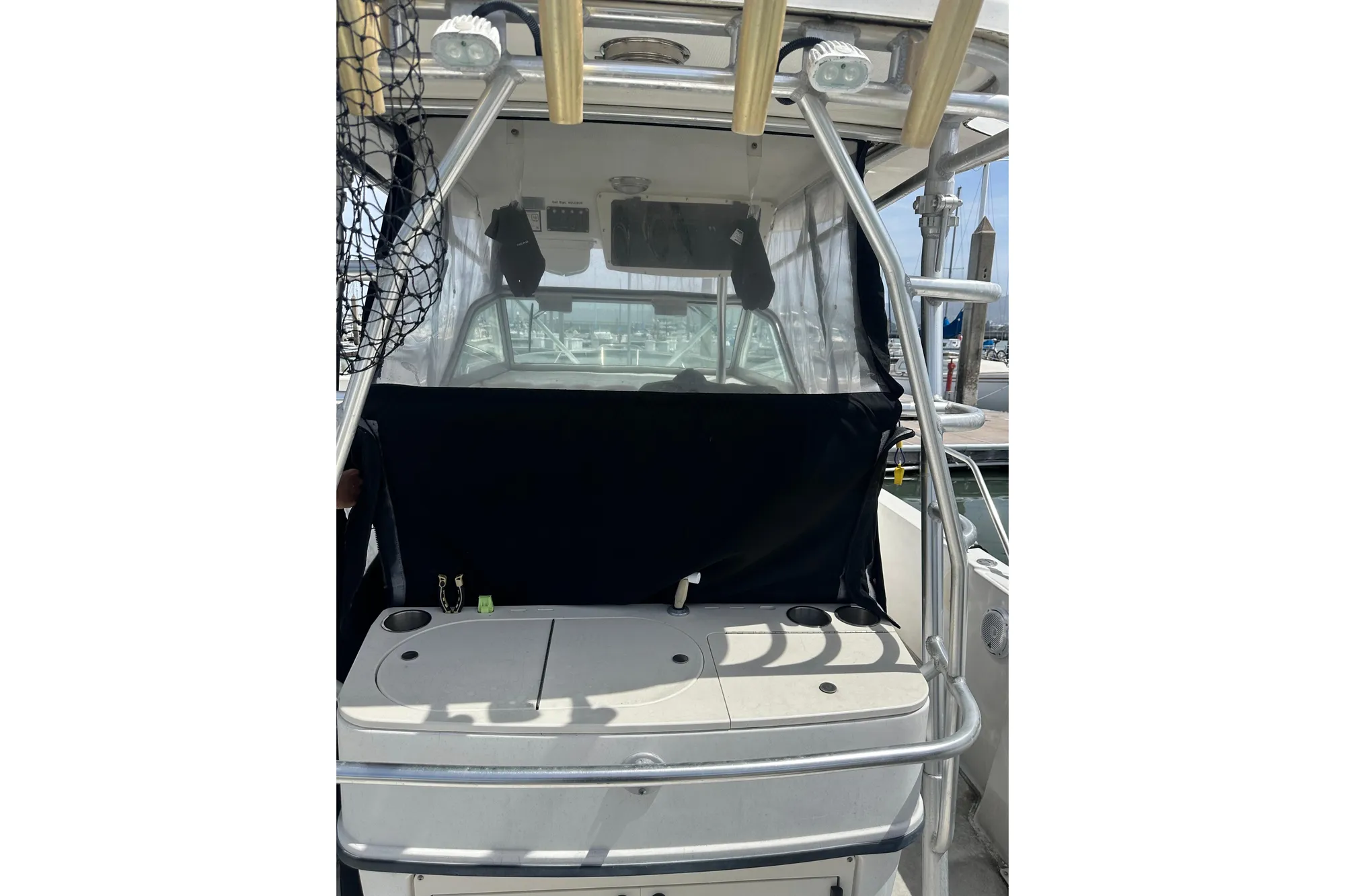 2001 Boston Whaler 28 Outrage boat interior with fishing gear and console.