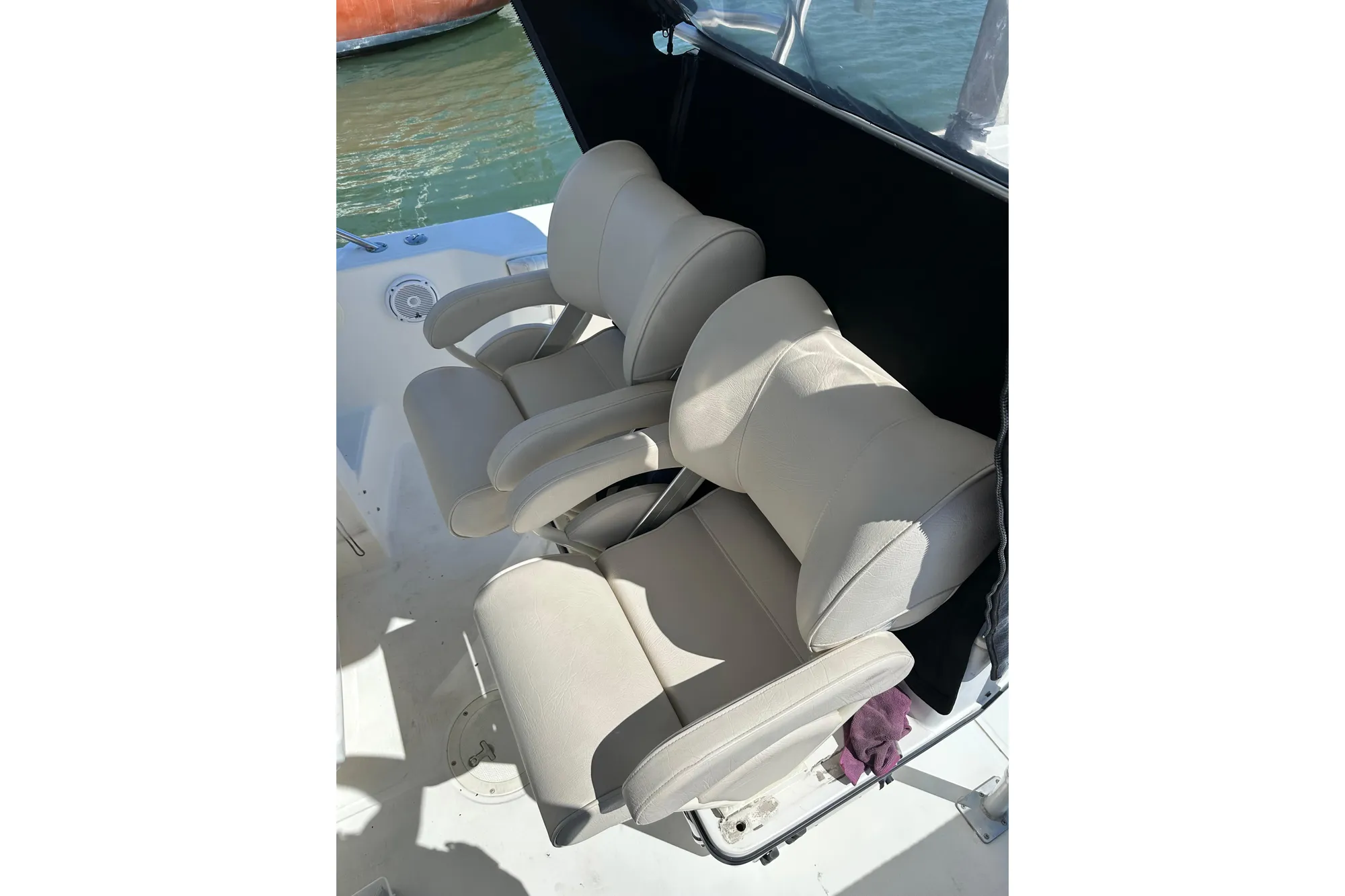 Comfortable seating on a 2001 Boston Whaler 28 Outrage boat, featuring plush, cushioned chairs.