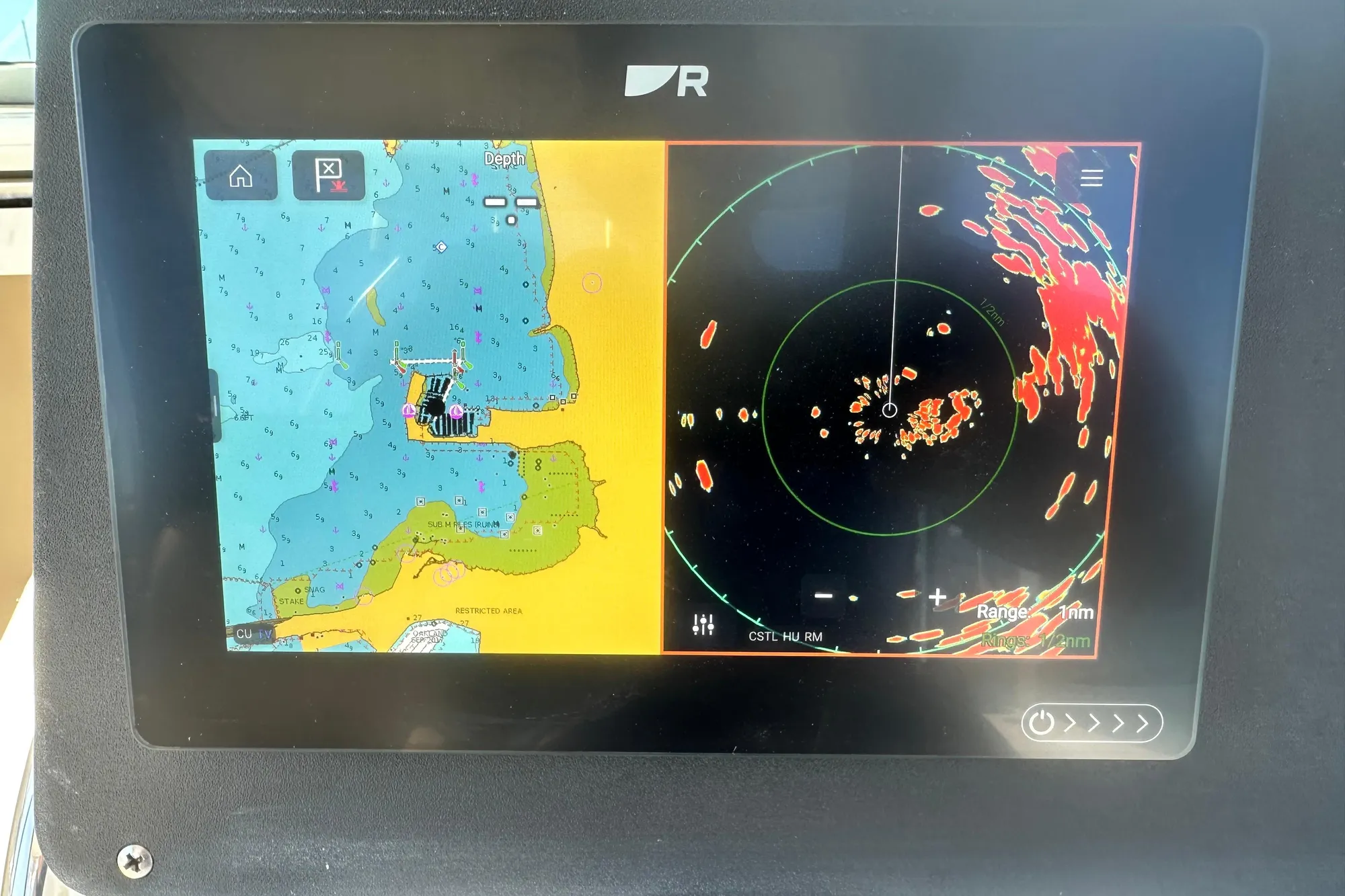 Navigation display on a 2001 Boston Whaler 28 Outrage, showing map and radar screens.