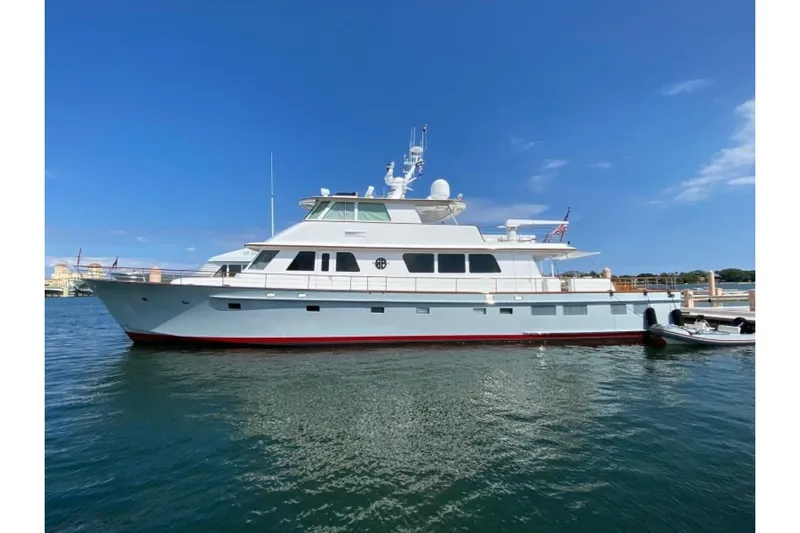 Sea Bold Yacht Photos Pics 2003 New England Boatworks Enclosed Raised Pilothouse yacht docked on a sunny day.