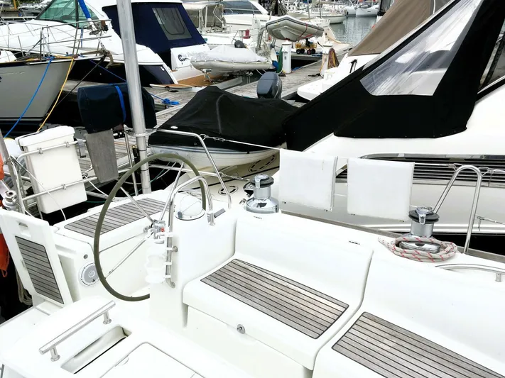  Yacht Photos Pics 2008 Beneteau 49 Oceanis Tall Rig sailboat docked at marina, featuring spacious cockpit.