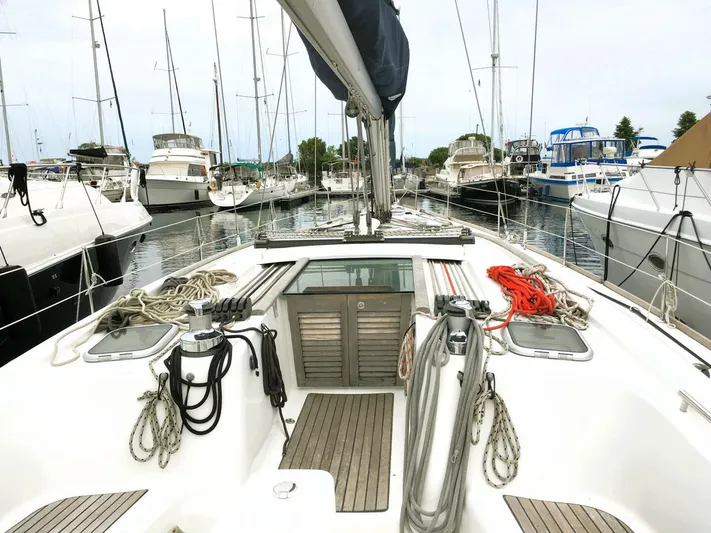  Yacht Photos Pics 2008 Beneteau 49 Oceanis Tall Rig sailboat docked in a marina, view from the deck.