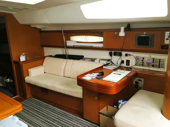  Yacht Photos Pics Interior of 2008 Beneteau 49 Oceanis Tall Rig with beige seating and navigation equipment.