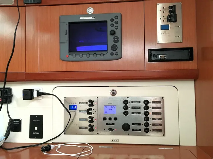  Yacht Photos Pics Control panel of a 2008 Beneteau 49 Oceanis Tall Rig sailboat, featuring navigation and electrical systems.