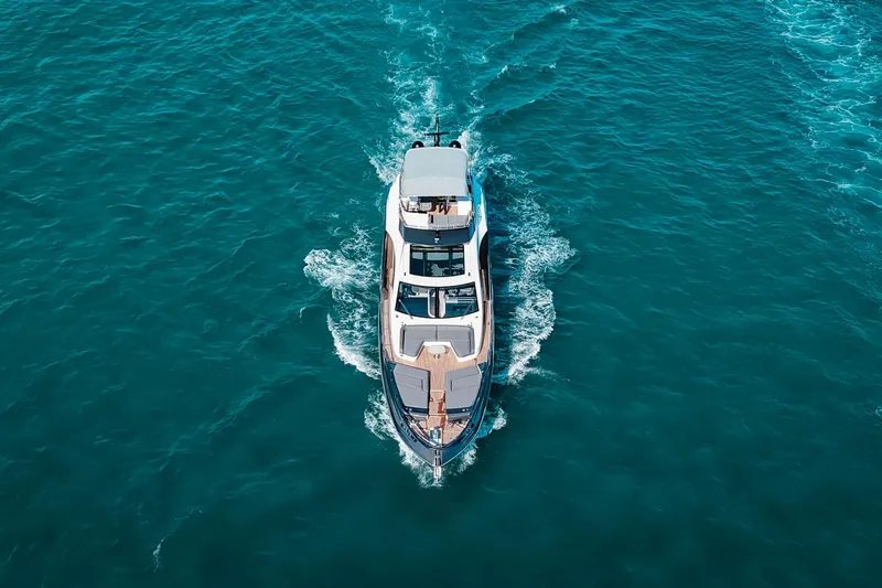  Yacht Photos Pics Aerial view of 2023 Azimut S8 yacht cruising on blue ocean waters.