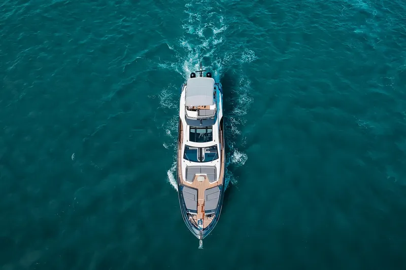 Yacht Photos Pics Aerial view of 2023 Azimut S8 yacht cruising on open water.