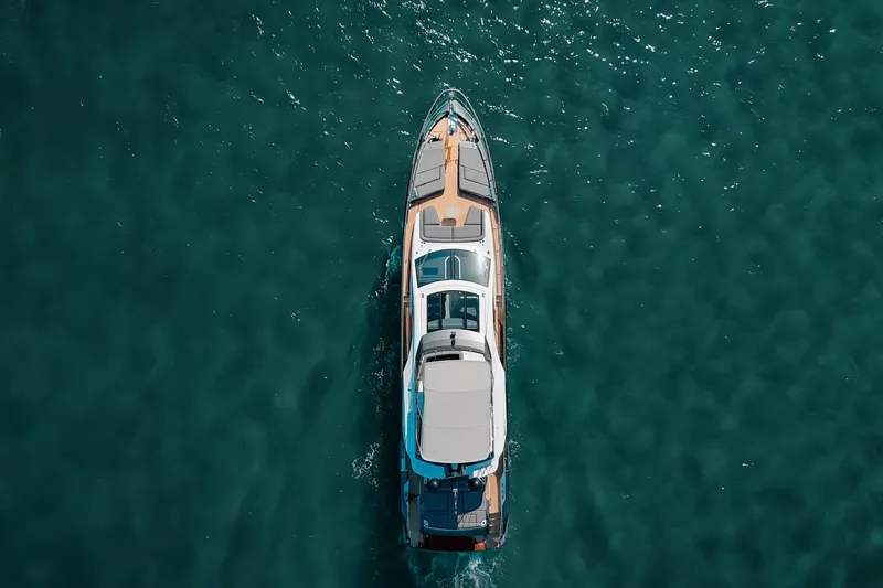  Yacht Photos Pics Aerial view of 2023 Azimut S8 yacht cruising on clear blue water.