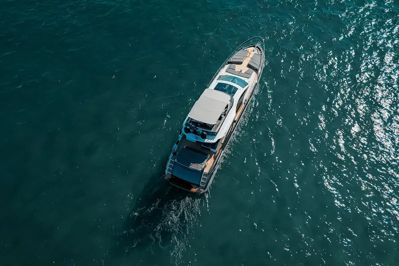  Yacht Photos Pics Aerial view of 2023 Azimut S8 yacht cruising on open water.