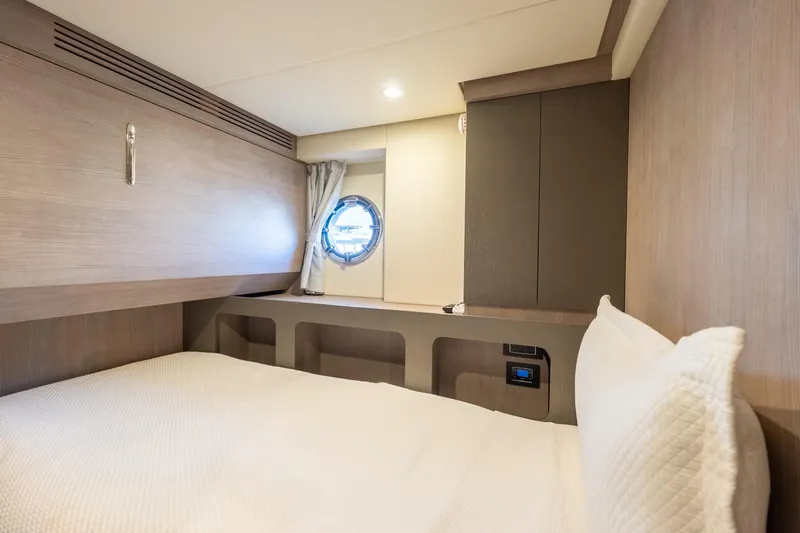  Yacht Photos Pics Luxurious cabin interior of 2023 Azimut S8 yacht with modern wood finishes.