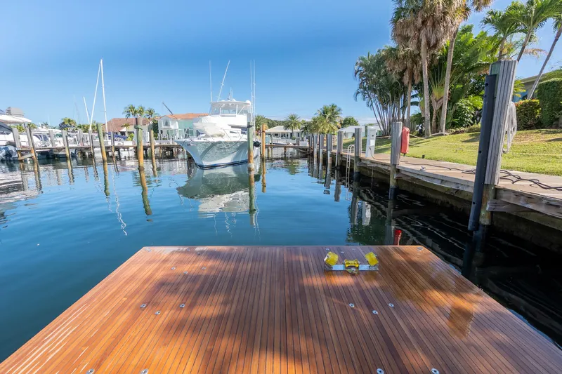  Yacht Photos Pics Dock view with Azimut S8 yacht, 2023 model, in a serene marina setting.