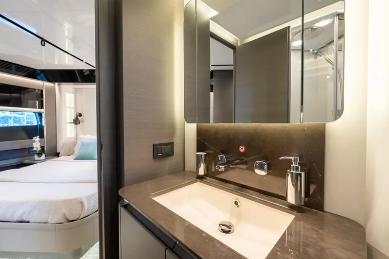  Yacht Photos Pics Luxurious bathroom interior of 2023 Azimut S8 yacht with modern fixtures and elegant design.