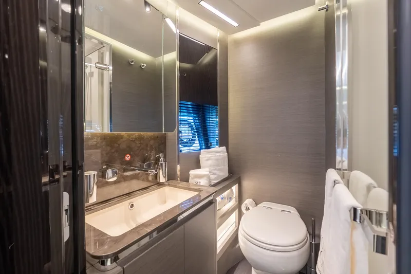  Yacht Photos Pics Luxurious bathroom in 2023 Azimut S8 yacht with modern fixtures and elegant design.