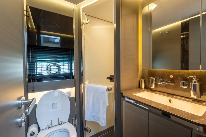  Yacht Photos Pics Luxurious bathroom in 2023 Azimut S8 yacht with modern fixtures and elegant design.