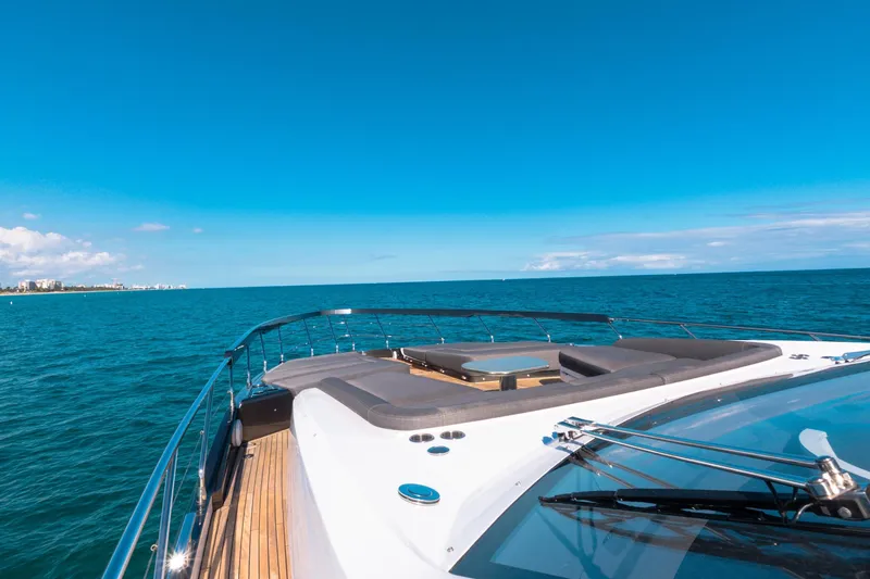  Yacht Photos Pics 2023 Azimut S8 yacht cruising on open sea under clear blue sky.