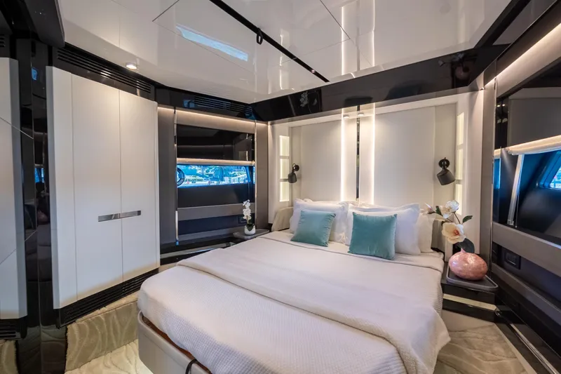  Yacht Photos Pics Luxurious bedroom interior of 2023 Azimut S8 yacht with modern design and elegant decor.