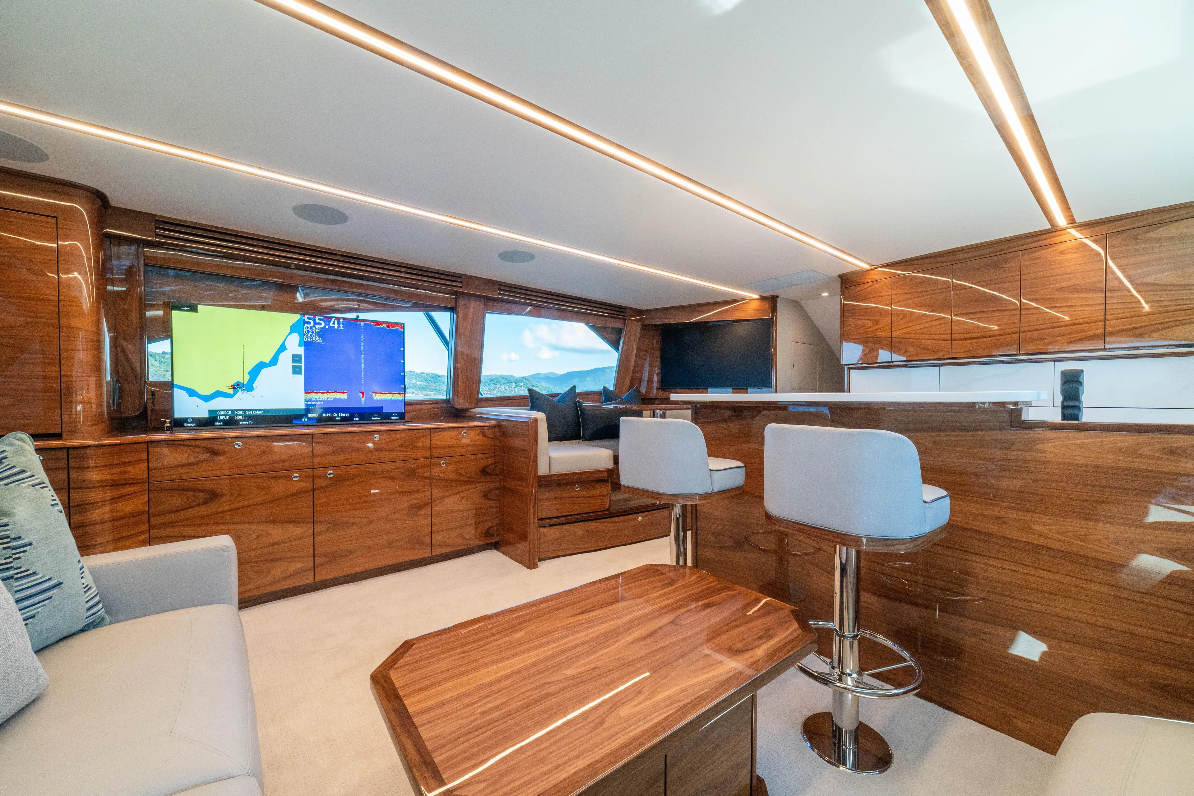 New Viking 64 Convertible Yacht Photos Pics Luxurious interior of 2026 Viking 64 Convertible yacht with modern wood finishes and seating.