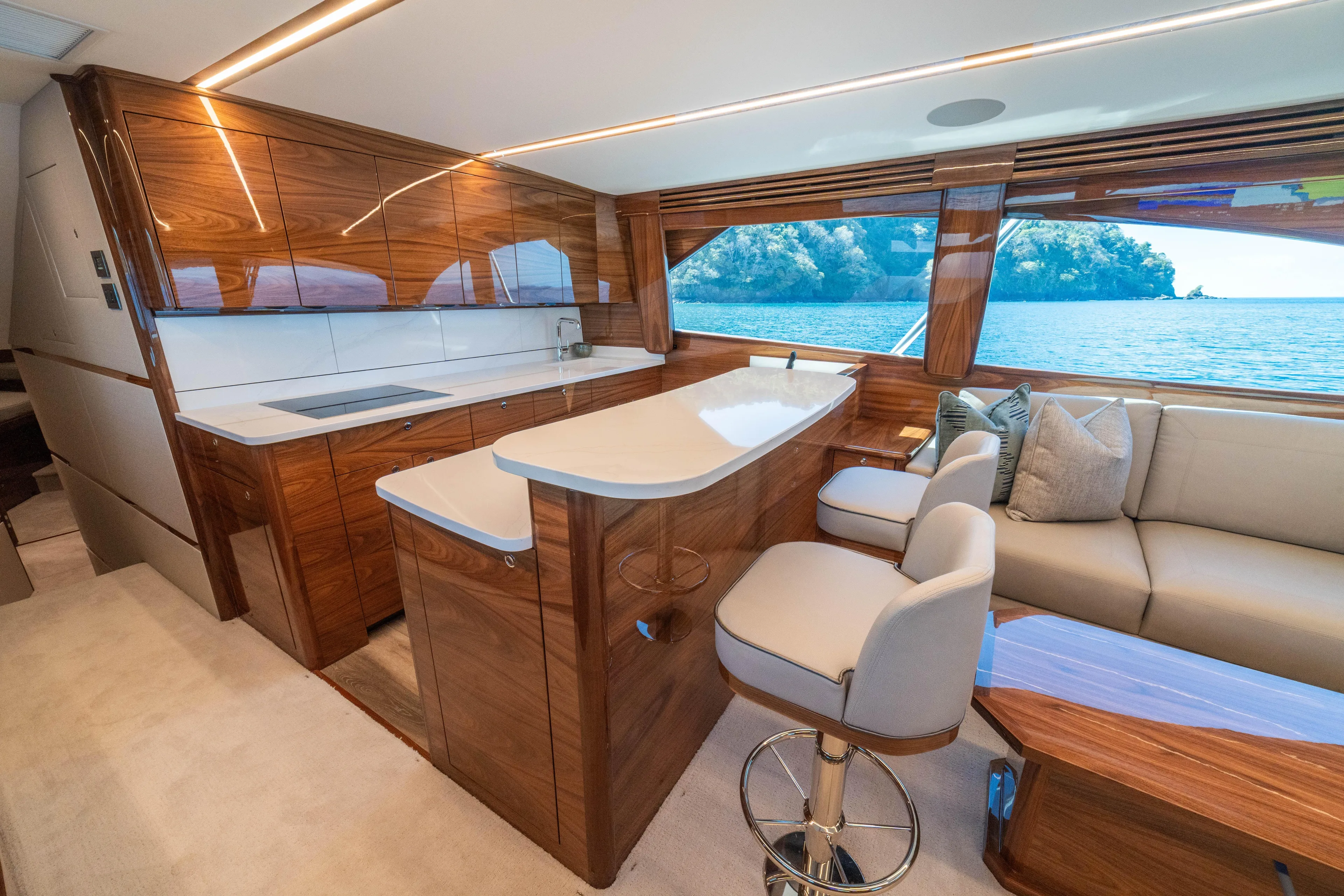 New Viking 64 Convertible Yacht Photos Pics Luxurious interior of 2026 Viking 64 Convertible yacht with elegant wood finishes and ocean view.