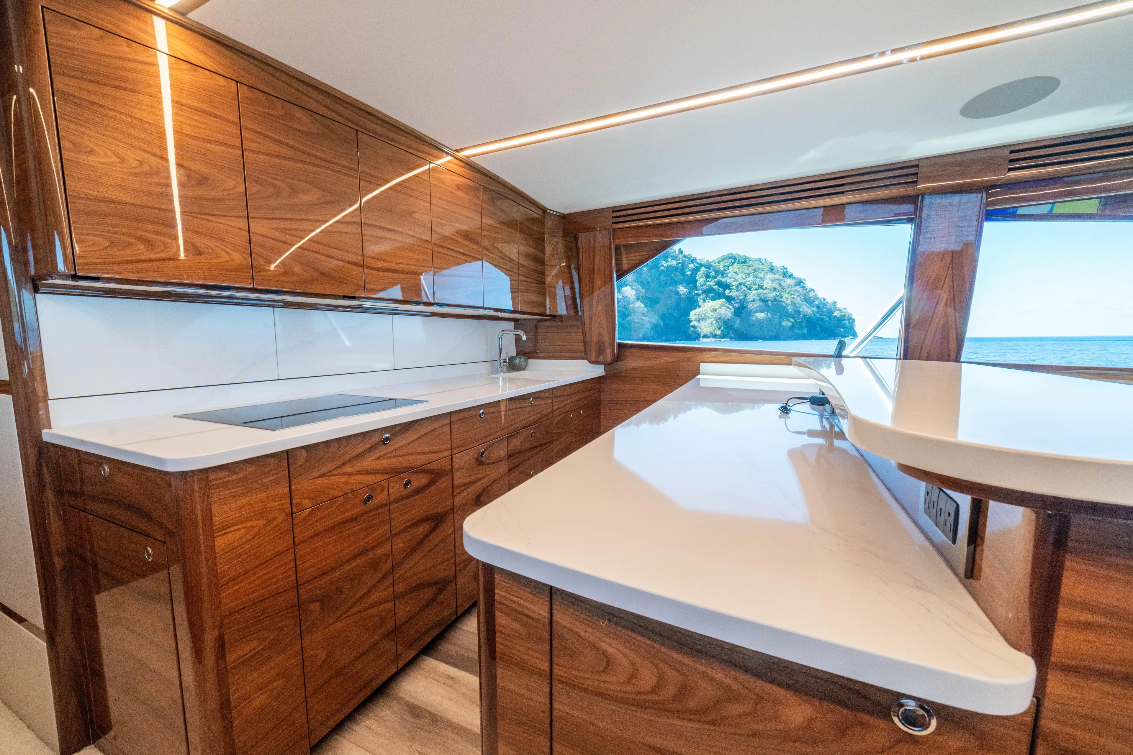 New Viking 64 Convertible Yacht Photos Pics Luxurious kitchen interior of 2026 Viking 64 Convertible yacht with ocean view.