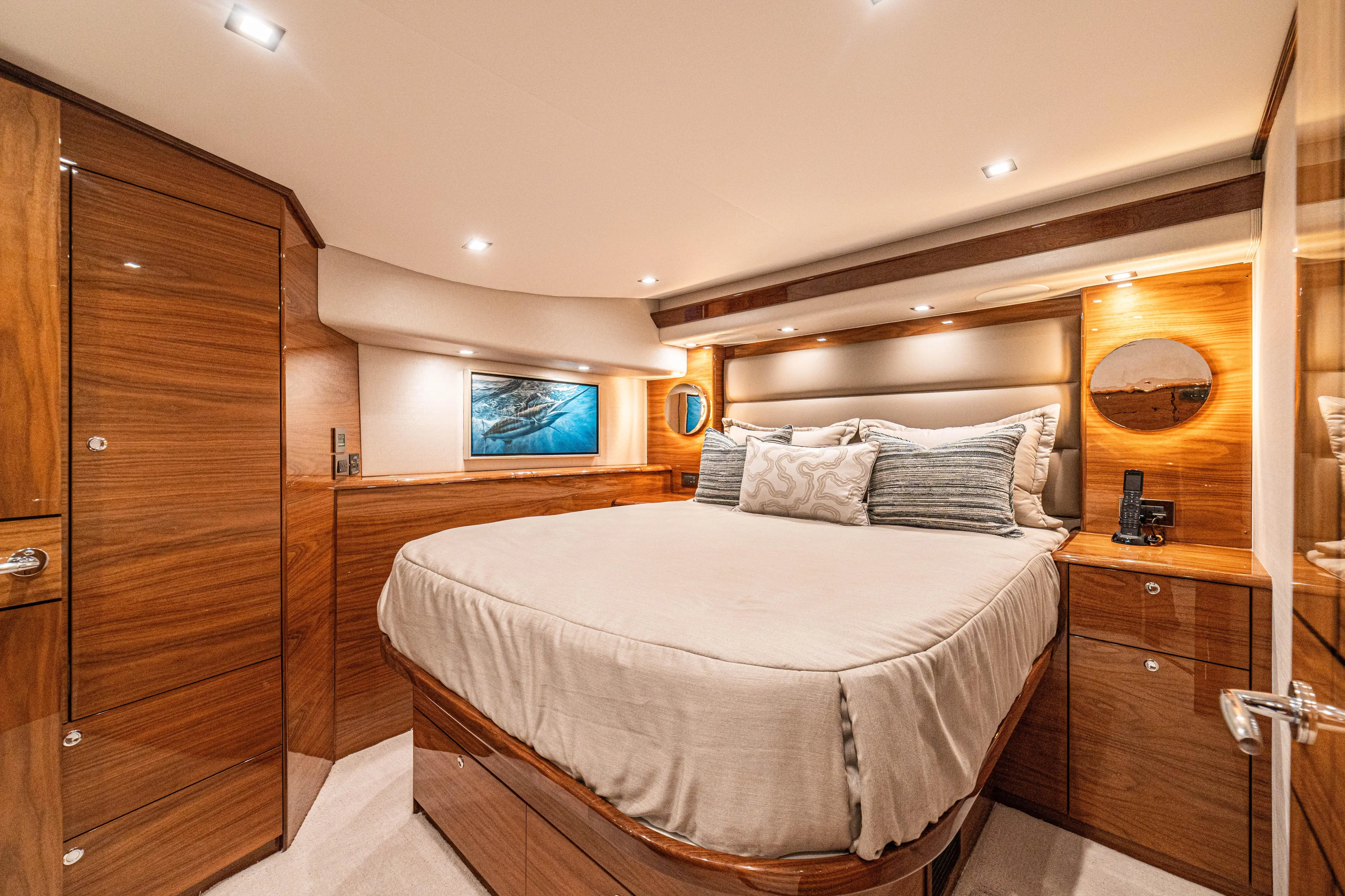 New Viking 64 Convertible Yacht Photos Pics Luxurious 2026 Viking 64 Convertible yacht bedroom with elegant wood finishes and modern lighting.