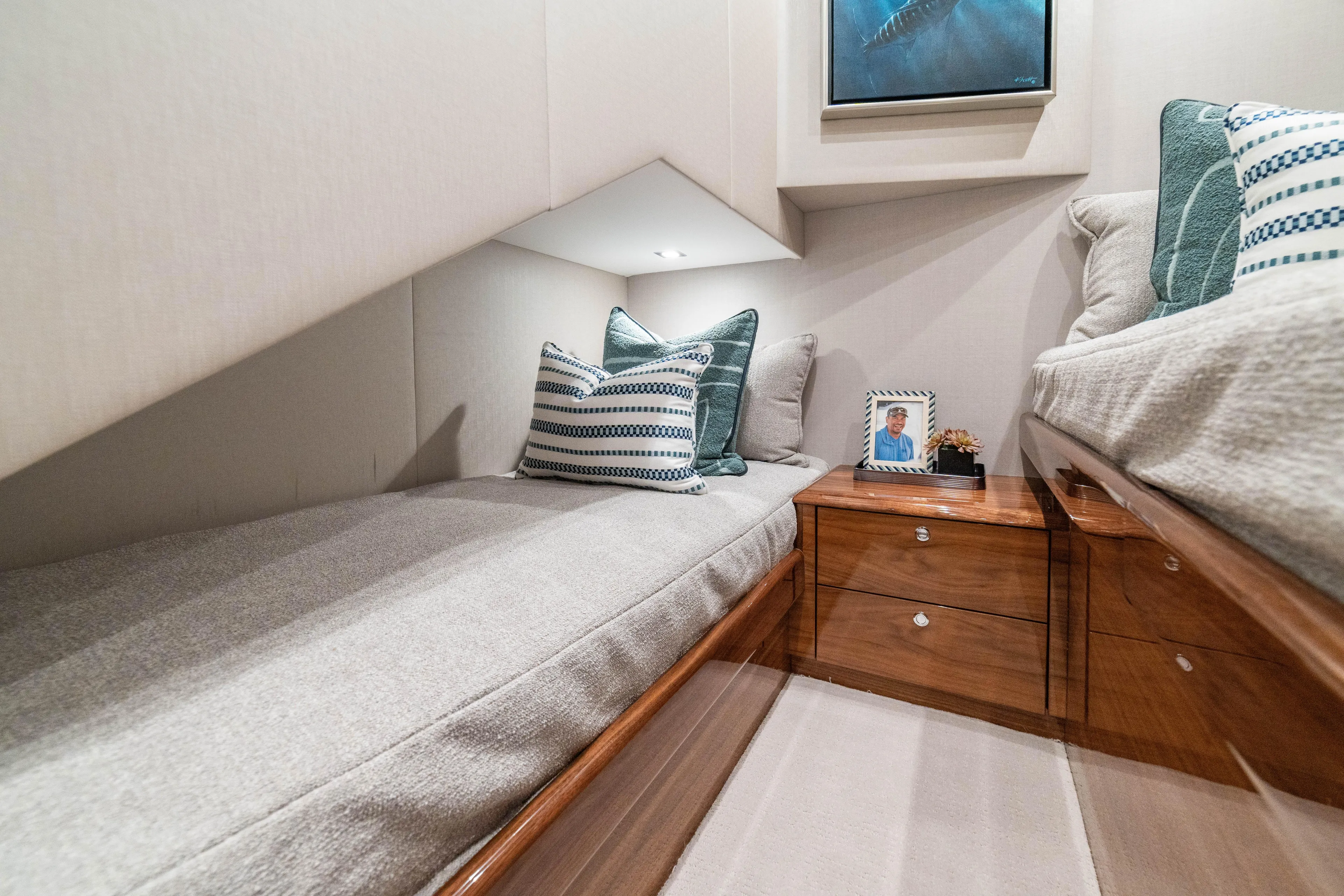 New Viking 64 Convertible Yacht Photos Pics Luxurious interior of 2026 Viking 64 Convertible yacht cabin with cozy bedding and decor.