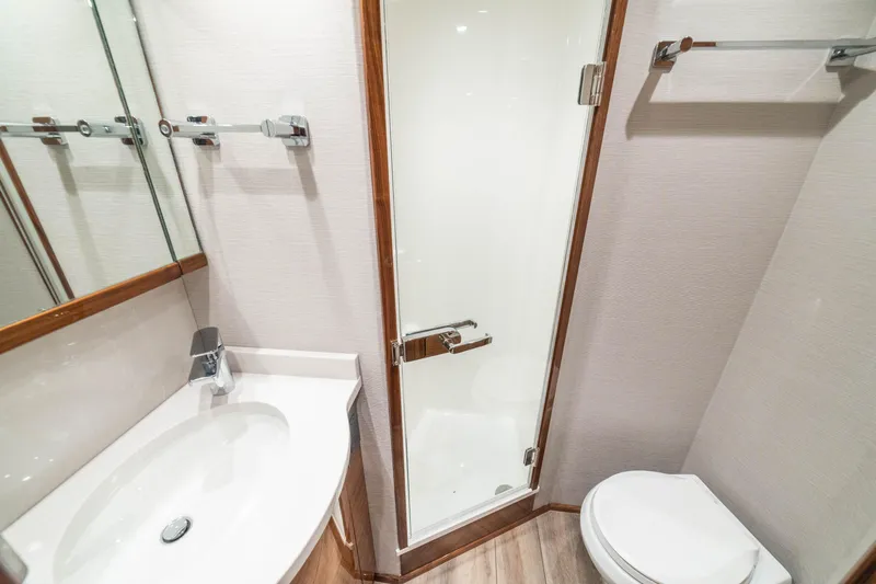 New Viking 64 Convertible Yacht Photos Pics Luxurious bathroom in 2026 Viking 64 Convertible yacht with modern fixtures and elegant design.