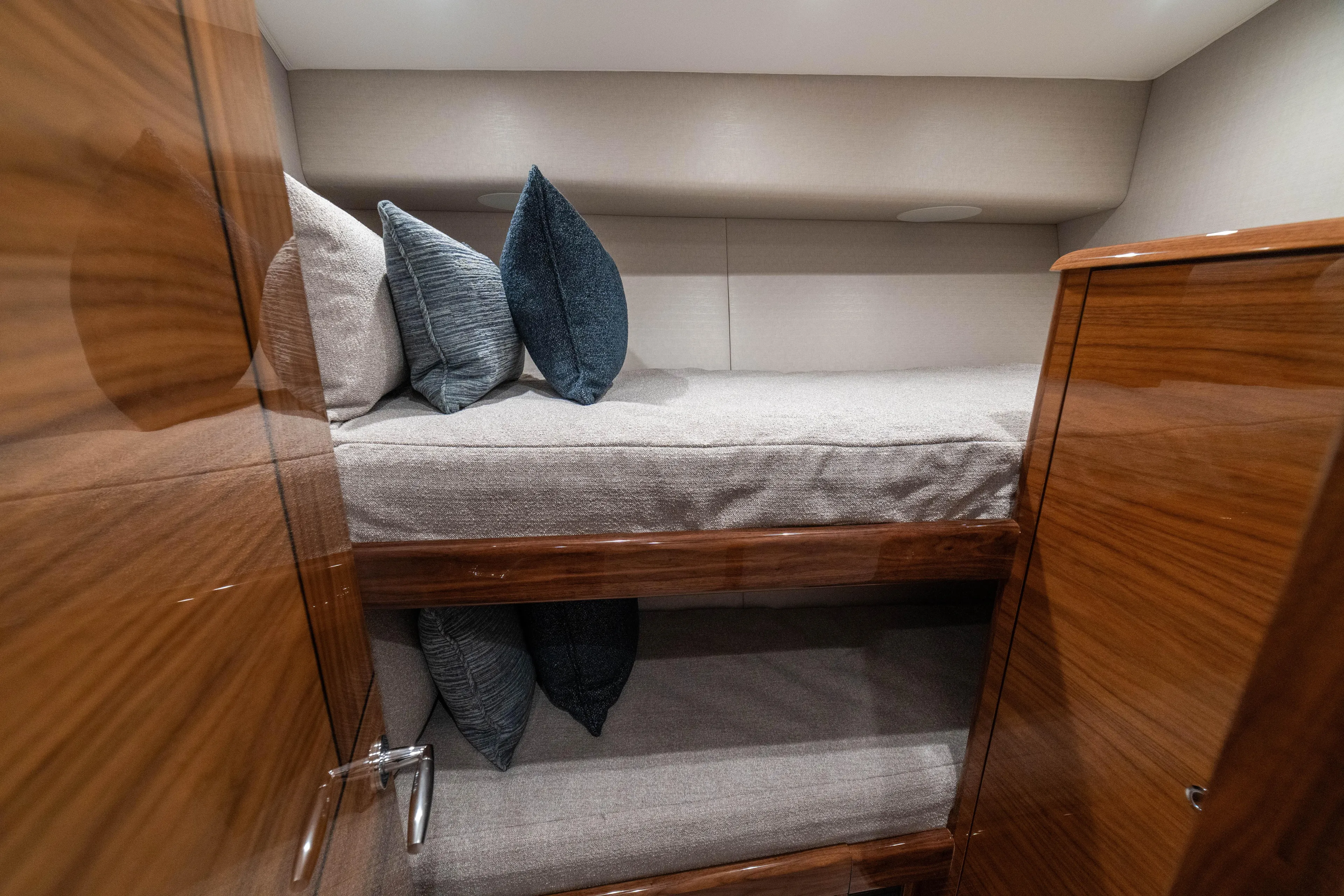 New Viking 64 Convertible Yacht Photos Pics 2026 Viking 64 Convertible yacht interior with cozy bunk beds and plush pillows.