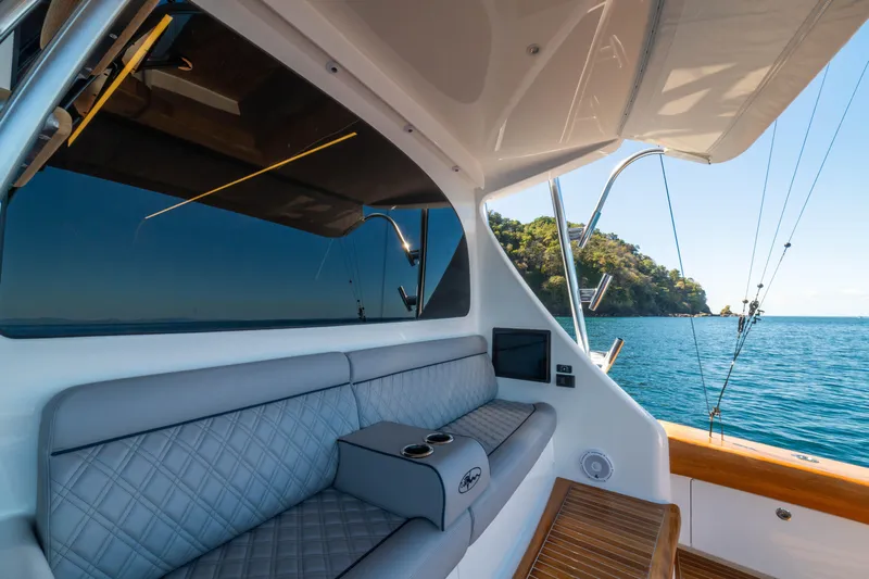 New Viking 64 Convertible Yacht Photos Pics 2026 Viking 64 Convertible yacht interior with ocean view and luxurious seating.