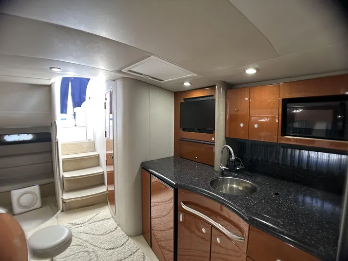 40 Formula Pc Yacht Photos Pics Interior of 2006 Formula 40 PC yacht with modern kitchen and stairs to deck.