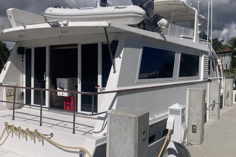 Raiders Yacht Photos Pics 1988 Viking 70 Cockpit Motor Yacht docked, featuring spacious deck and modern amenities.