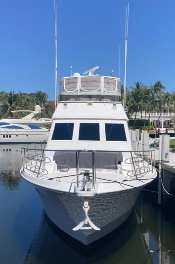Raiders Yacht Photos Pics 1988 Viking 70 Cockpit Motor Yacht docked in a marina.