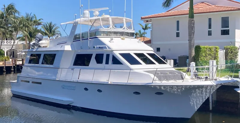 Raiders Yacht Photos Pics 1988 Viking 70 Cockpit Motor Yacht docked near waterfront homes.