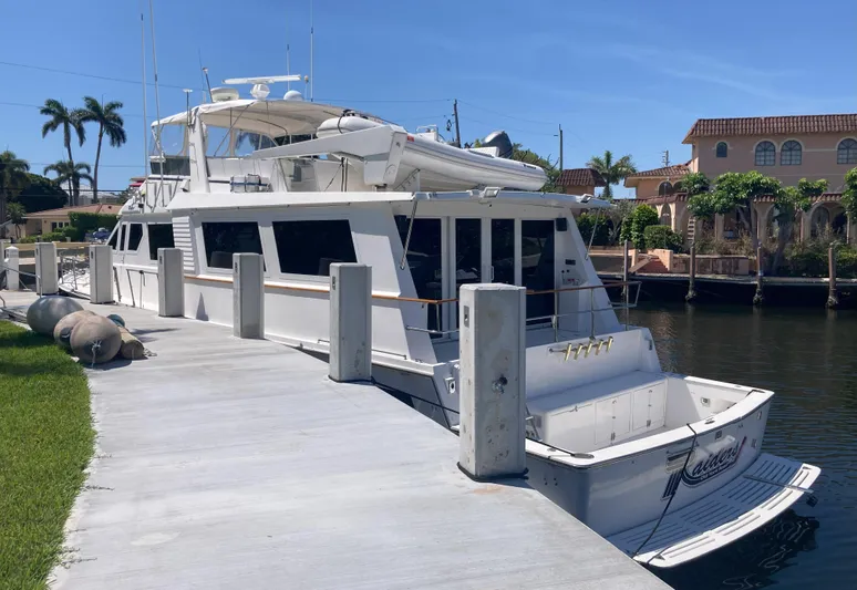 Raiders Yacht Photos Pics 1988 Viking 70 Cockpit Motor Yacht docked at a marina.