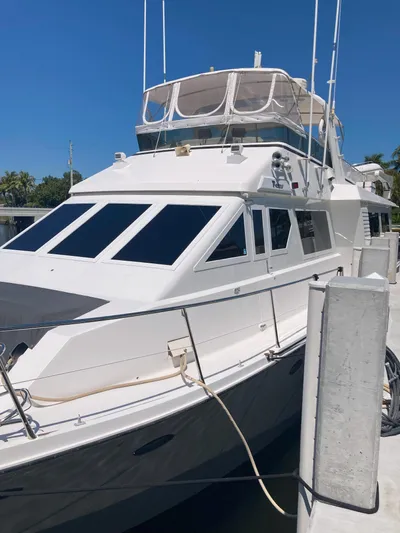 Raiders Yacht Photos Pics 1988 Viking 70 Cockpit Motor Yacht docked at marina.