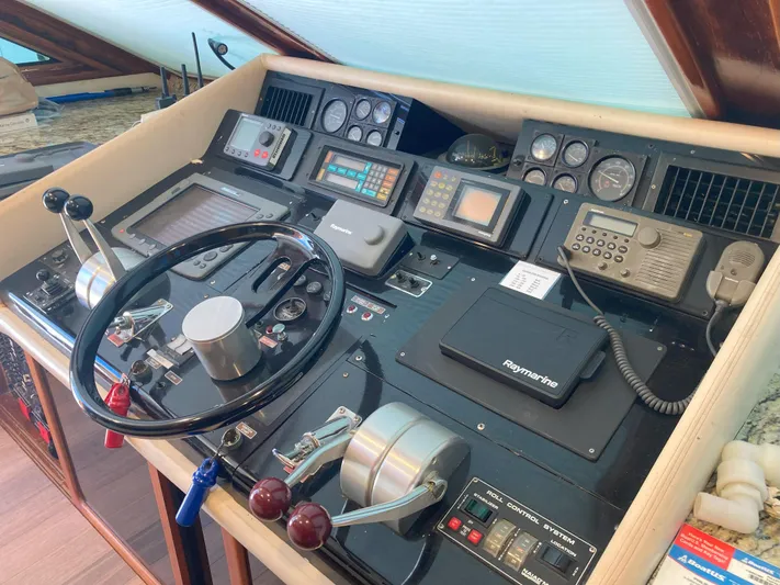 Raiders Yacht Photos Pics Control panel of a 1988 Viking 70 Cockpit Motor Yacht with navigation and communication equipment.