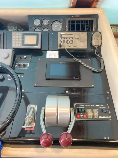 Raiders Yacht Photos Pics Control panel of a 1988 Viking 70 Cockpit Motor Yacht with navigation and communication equipment.