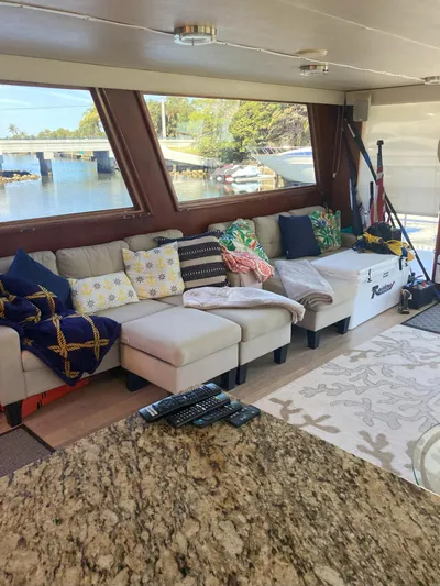 Raiders Yacht Photos Pics Interior of 1988 Viking 70 Cockpit Motor Yacht with cozy seating and waterfront view.